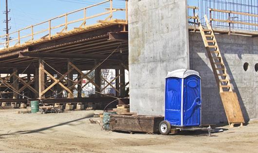 work site porta potties arranged in an orderly and convenient manner for workers